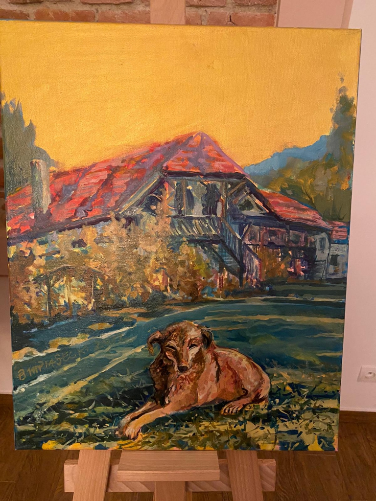 Obraz przedstawiający psa, w oddali dom oraz góry.